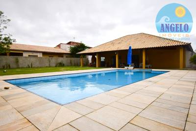 Casa com piscina para venda no bairro Oásis em Peruíbe, entre 800 e 1200 metros da praia